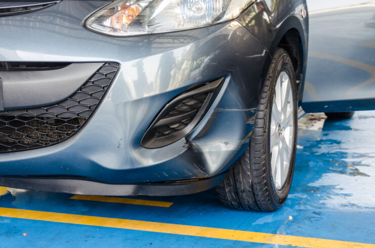 Damaged Front Bumper After Car Collision