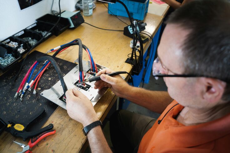 Mechanic repairing a mechanical contraption