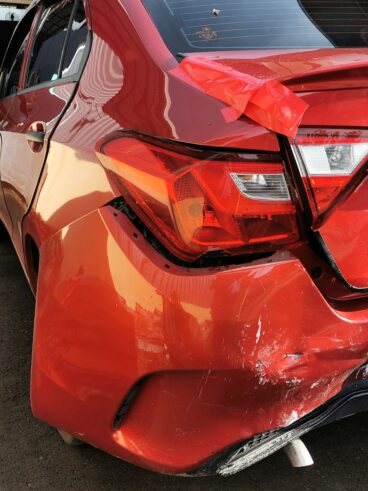 Photo of car with broken bumper after accident