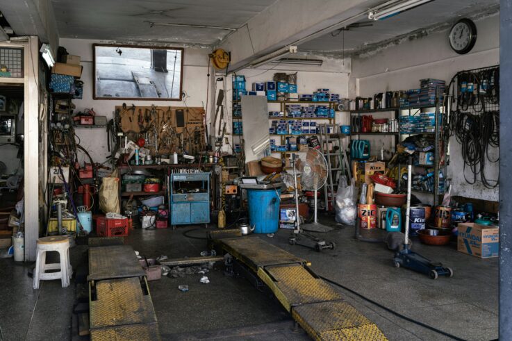 Collision repair garage interior with tools and equipment